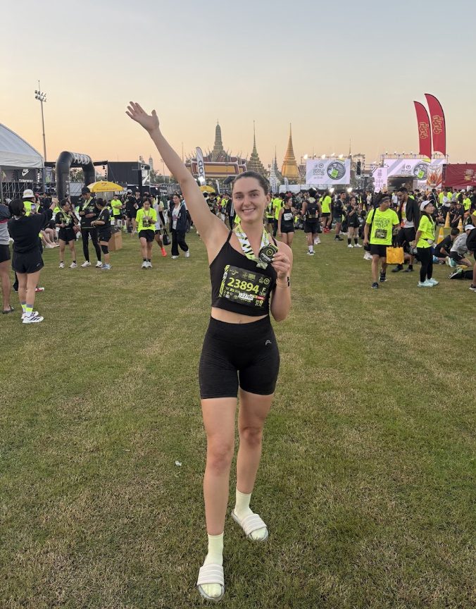 Olivia celebrating after finishing a race in Bangkok